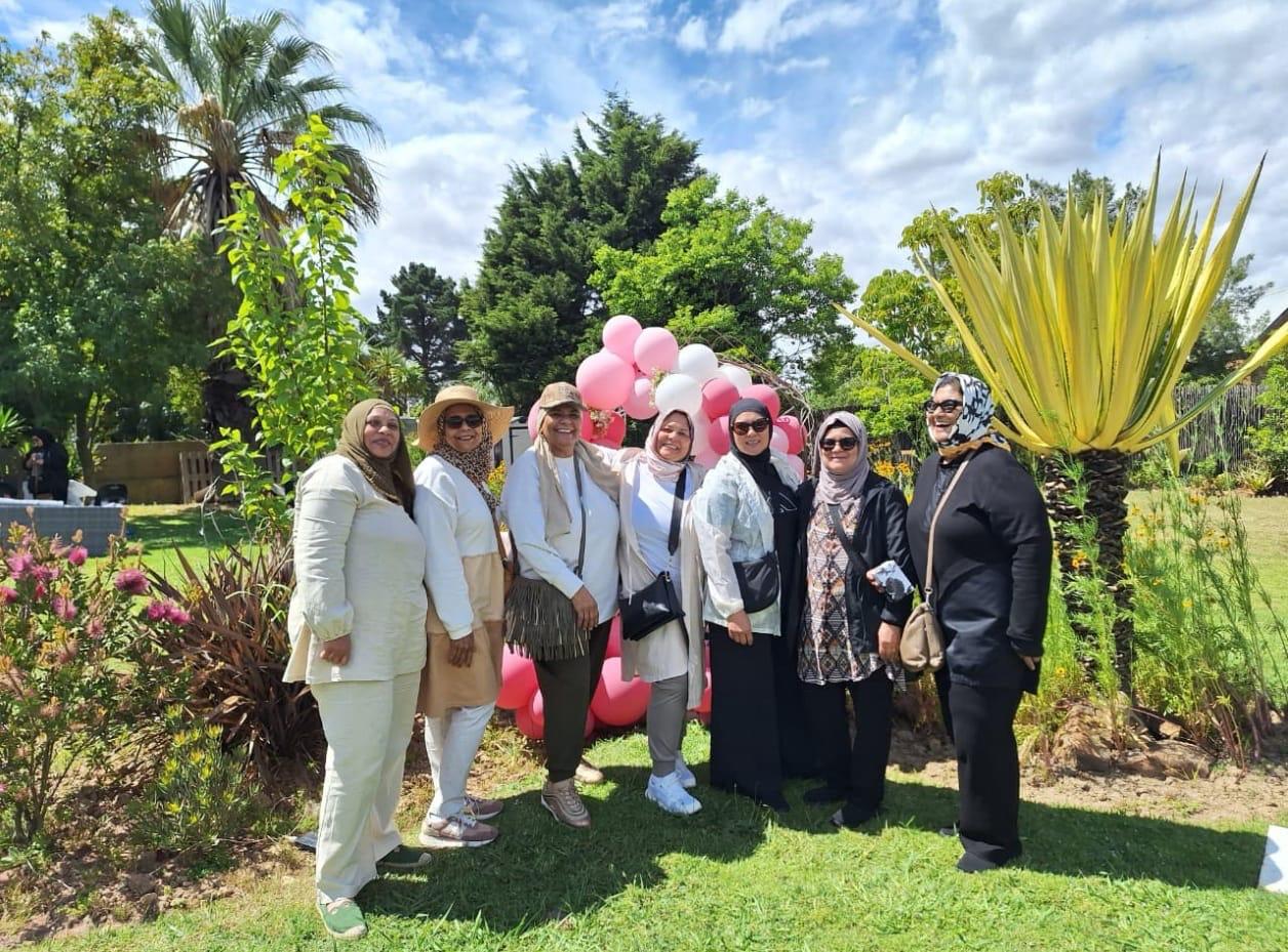 Sisters at an outdoor community celebration